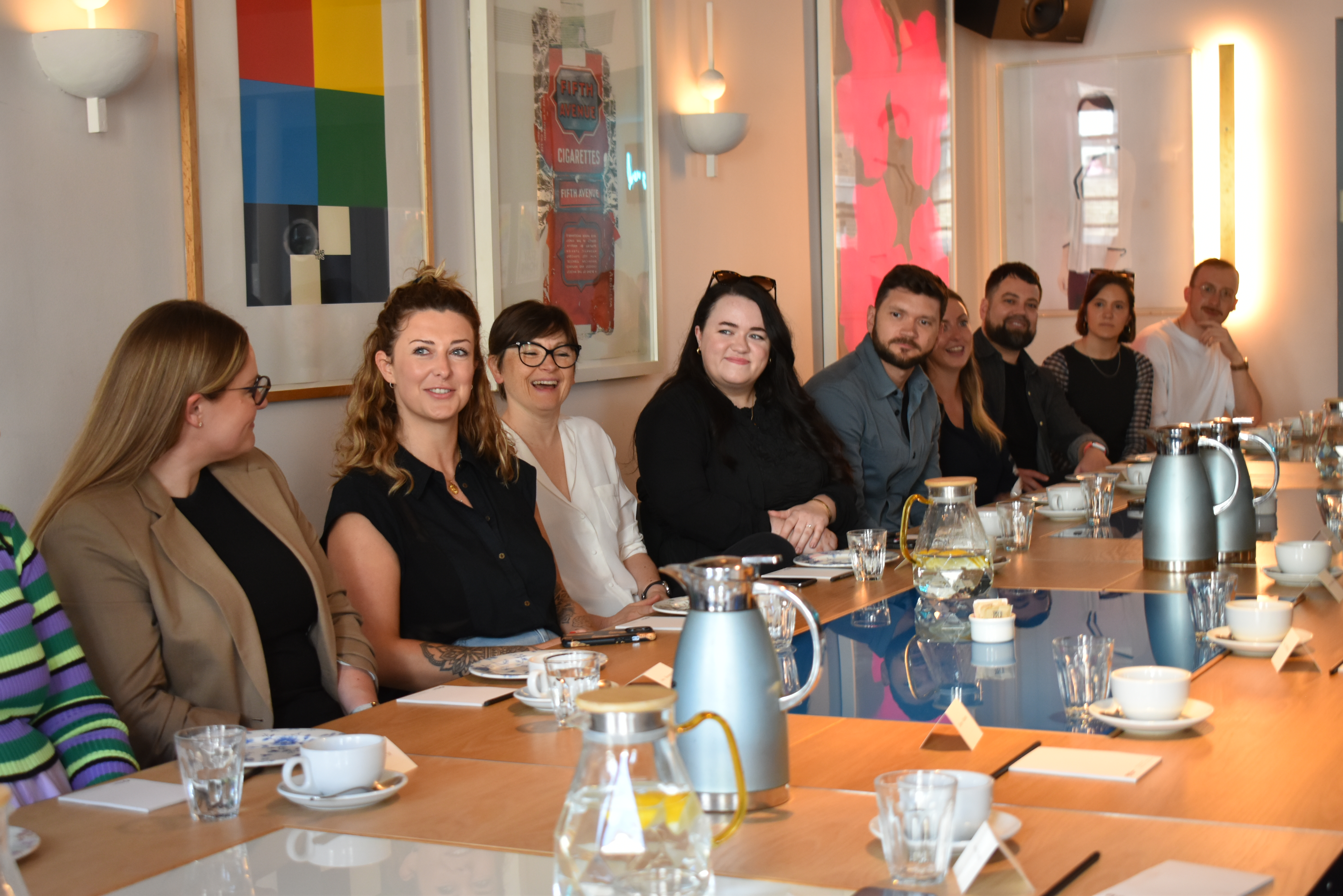 Image of attendees around the table at the People Leaders Breakfast.